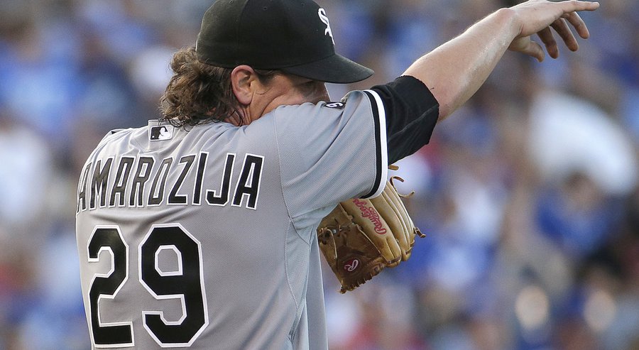 Chicago White Sox starting pitcher Jeff Samardzija wipes his face after allowing a run during the fourth inning of a baseball game against the Kansas City Royals Saturday Aug. 8 2015 in Kansas City Mo