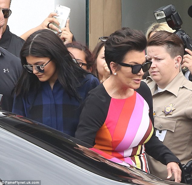 Mother-daughter outing The Keeping Up with the Kardashians star was joined on Melrose Avenue by her momager Kris wearing a rainbow-striped LBD