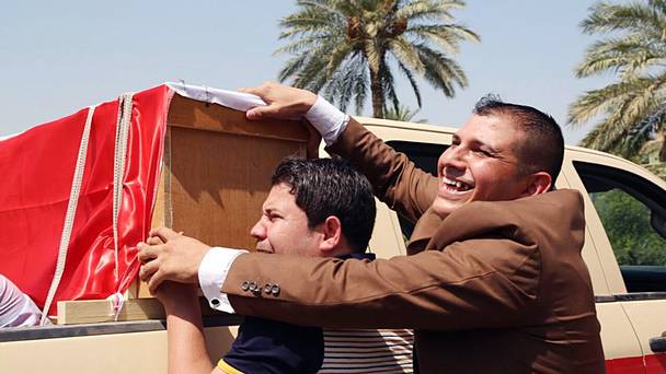 Mourners grieve during the funeral procession of Major General Abdul Rahman Abu-Regheef and Brigadier General Sefeen Abdul-Maguid