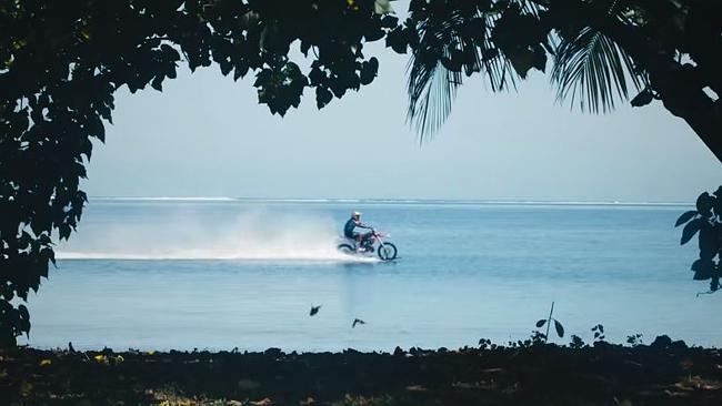 Nothing to see here just a man and his motorbike in the middle of the ocean