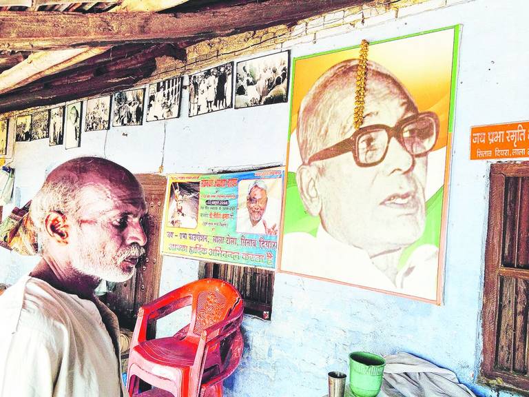 On the verandah of JP's dilapidated home an exhibition of tattered