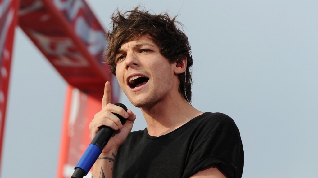 One Direction's Louis Tomlinson I'm'buzzing about becoming a dad