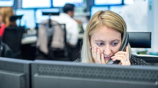 A trader at the stock exchange in Frankfurt Germany Monday