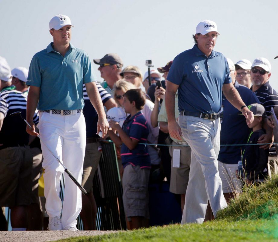 Phil Mickelson and Jordan Spieth walk to the tee on the fourth hole during a practice round for the PGA Championship golf tournament Tuesday Aug. 11 2015 at Whistling Straits in Haven Wis