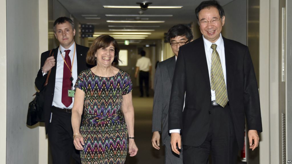 FILE- Acting Deputy U.S. Trade Representative Wendy Cutler is greeted by her Japanese counterpart Hiroshi Oe before their talks of the Trans Pacific Partnership free trade negotiations at the Foreign Ministry in Tokyo July 2015