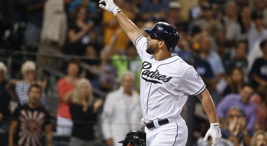 San Diego Padres&#39 Yonder Alonso signals to someone in the crowd as he crosses homes plate with his home run against the Miami Marlins during the fifth inning of a baseball game Friday