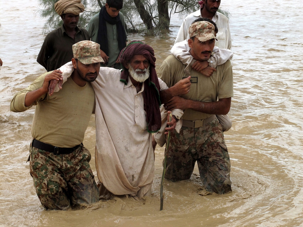 Pakistani Army soldiers rescue people affected by floods in Dera Ismail Khan on August 3