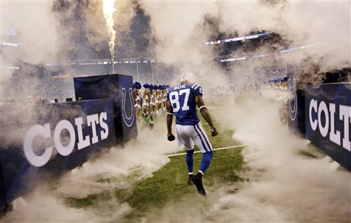 Indianapolis Colts wide receiver Reggie Wayne runs onto the field during introductions before the start of an NFL football game against the Philadelphia Eagles Monday Sept. 15 2014 in Indianapolis