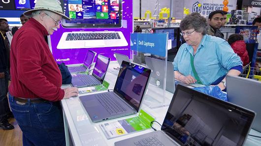 Shoppers looking at computers