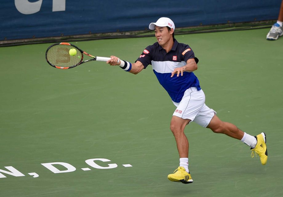 Kei Nishikori of Japan returns the ball against Marin Cilic of Croatia at the Citi Open tennis tournament Saturday Aug. 8 2015 in Washington