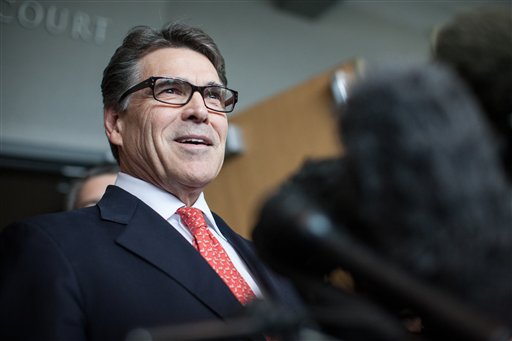 Texas Gov. Rick Perry answers questions from the media following a hearing on felony abuse of power charges at the Blackwell Thurman Criminal Justice Center in Austin Texas