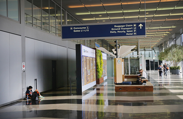 SEPTEMBER 27 Stranded passengers wait for flights in a deserted area of O'Hare International Airport