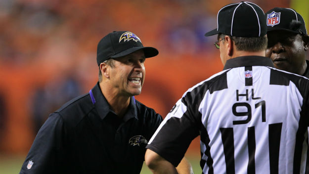 John Harbaugh asks a woman to validate his comparison of training camp to