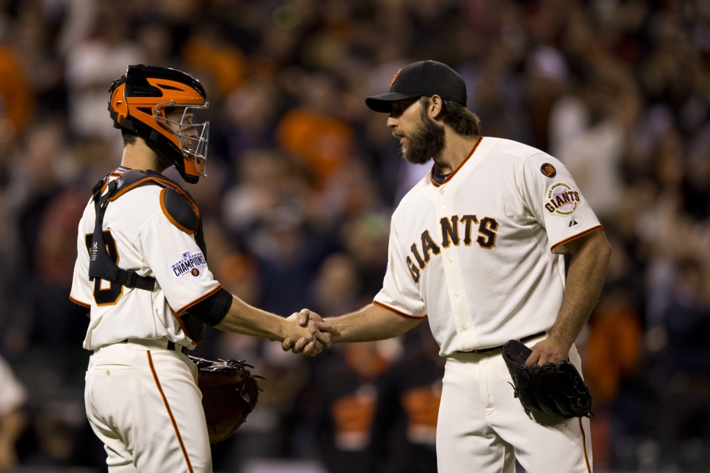 SAN FRANCISCO CA- AUGUST 11 Madison Bumgarner #40 of the San Francisco Giants shakes hands with Buster Posey #28 after the game against the Houston Astros at AT&T Park