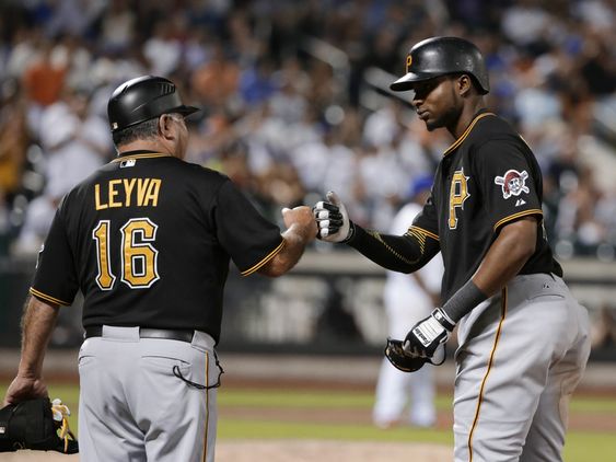 Polanco right celebrates with first base coach Nick Leyva after hitting an RBI single during the 10th inning of a baseball game against the New York Mets on Friday Aug. 14 2015 in New York. (AP