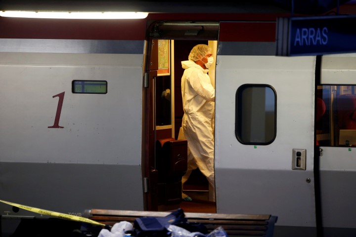 Police in protective clothing collect clues inside the train Pascal Rossignol