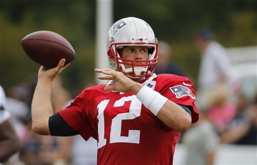 New England Patriots quarterback Tom Brady tosses a pass during a joint practice with the New Orleans Saints at the Saints&#039 NFL football training camp in White Sulphur Springs WVa