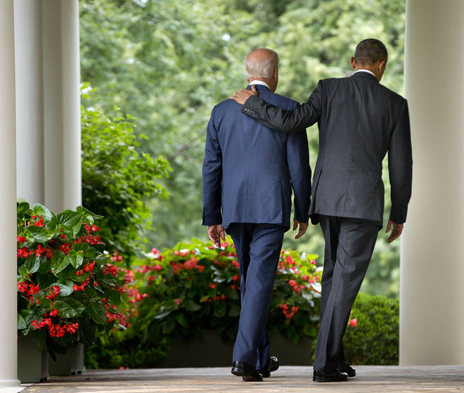 President Barack Obama walks with Vice President Joe Biden back to the Oval Office of the White House in Washington after the president spoke speaking in the Rose Garden. President Barack Obama is the man in the