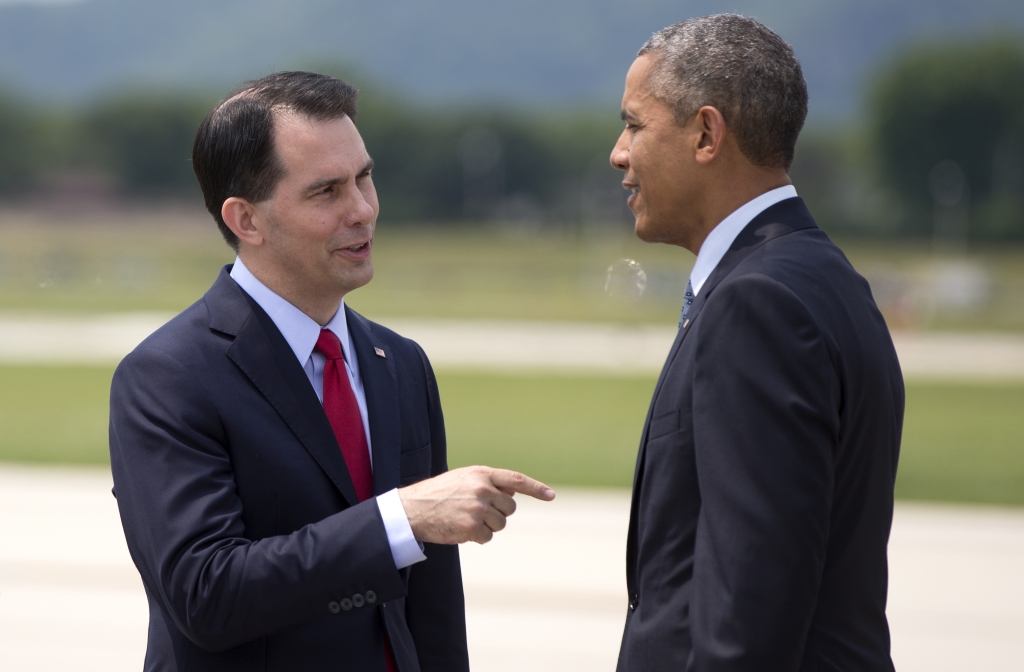 President Obama talks with Wisconsin Gov. Scott Walker as he arrives in La Crosse Wis. in early July