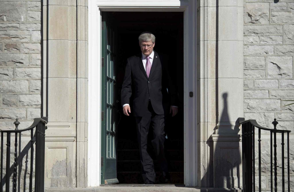 Prime Minister Stephen Harper steps out of his residence at 24 Sussex drive Monday