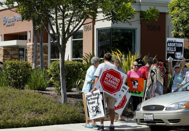 Protesters gather outside a Planned Parenthood clinic in Vista California