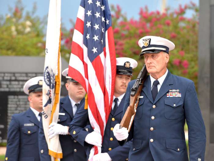 The U.S. Coast Guard Jacksonville Sector presents the colors. The annual Purple Heart Recognition Day ceremony was held at the Veterans Memorial Wall and along the Purple Heart Trail Friday