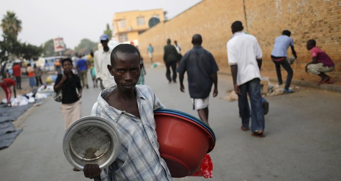 A man sells pots at a marketplace in Burundi's capital Bujumbura as the country awaits the results of Tuesday's presidential elections