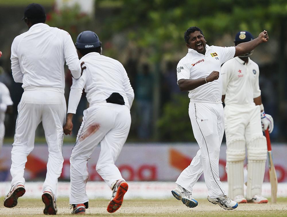 Rangana Herath celebrating the wicket of Harbhajan Singh on day four of the first Test in Galle