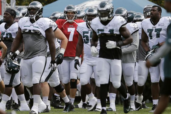 Sam Bradford and his teammates move to their next drill during NFL football training camp