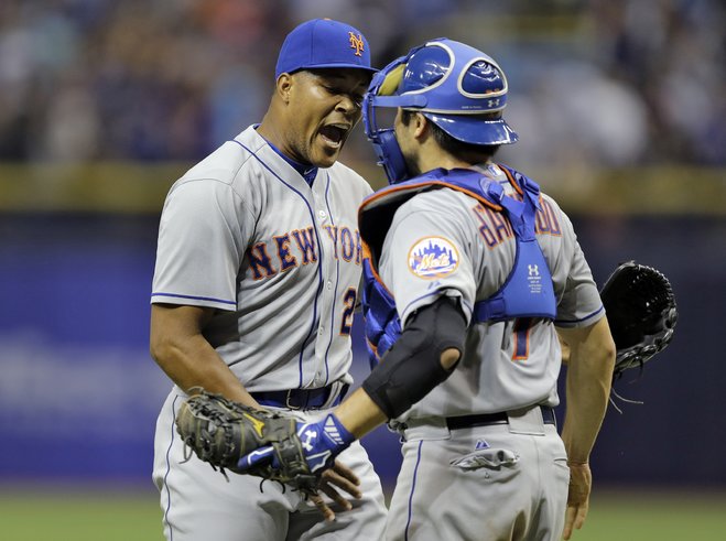 New York Mets relief pitcher Jeurys Familia left celebrates with catcher Travis d'Arnaud after closing out the Tampa Bay Rays during the ninth inning of an interleague baseball game Friday Aug. 7 2015 in St. Petersburg Fla. The Mets won the game 4-3