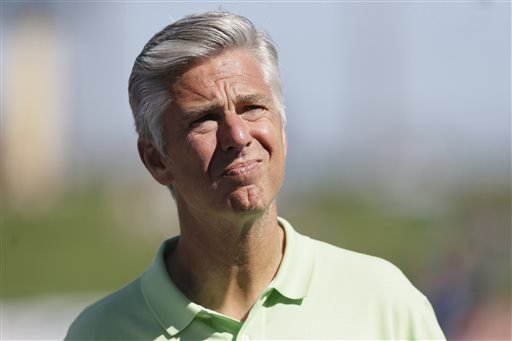 Dave Dombrowski then Detroit Tigers general manager waits for a spring training baseball game between the Tigers and the Washington Nationals in Lakeland Fla. The Boston Red Sox have hired former Tigers boss D