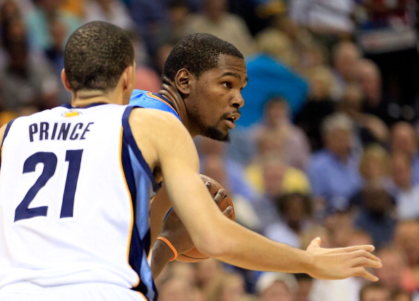 MEMPHIS TN- MAY 11 Kevin Durant #35 of the Oklahoma City Thunder controls the ball as Tayshaun Prince #21 of the Memphis Grizzlies defends during Game Three of the Western Conference Semifinals of the 2013 NBA Playoffs at FedExForum