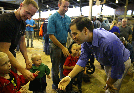 Republican presidential candidate and US Senator Marco Rubio greets fairgoers while touring the Iowa State Fair in Des Moines Iowa yesterday