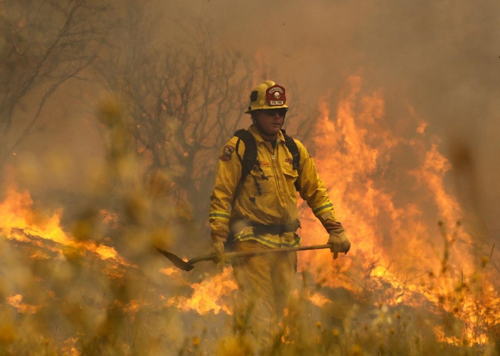 482553290-cal-fire-firefighter-johnny-miller-monitors-flames-from