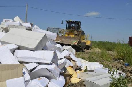 Food items that Russia says were illegally imported were pushed into a landfill Thursday in the Belgorod region