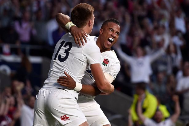 England's Anthony Watson celebrates scoring their first try with Henry Slade during the England against France match for the QBE International at Twickenham Stadium London