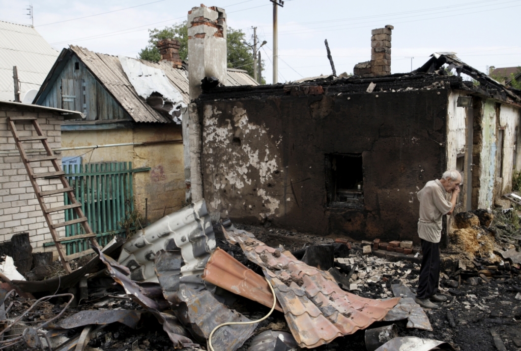 ReutersA man cries outside his damaged house which locals said was hit by shelling in Donetsk Ukraine