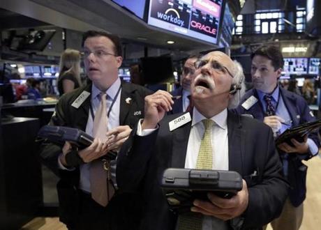 Traders on the floor of the New York Stock Exchange on Monday