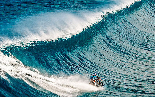 Robbie'Maddo Maddison surfs the waves of Tahiti on his dirtbike