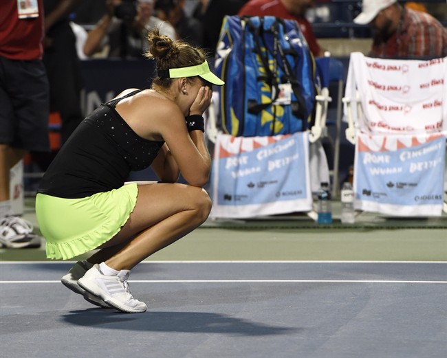 Belinda Bencic of Switzerland reacts after defeating Serena Williams of the United States during Rogers Cup semi-final tennis action in Toronto on Saturday