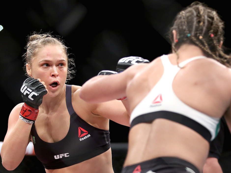 Ronda Rousey fights Bethe Correia in their bantamweight title fight during the UFC 190