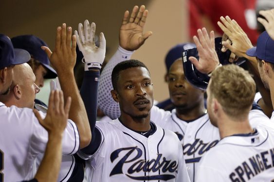 Melvin Upton Jr. center is greeted by teammates after hitting a two-run home run against the Atlanta Braves during the sixth inning of a baseball game Tuesday Aug. 18 2015 in San Diego