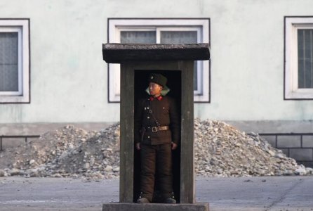 A soldier stands guard at a sentry on the banks of the Yalu River near the North Korean town of Sinuiju opposite the Chinese border city of Dandong