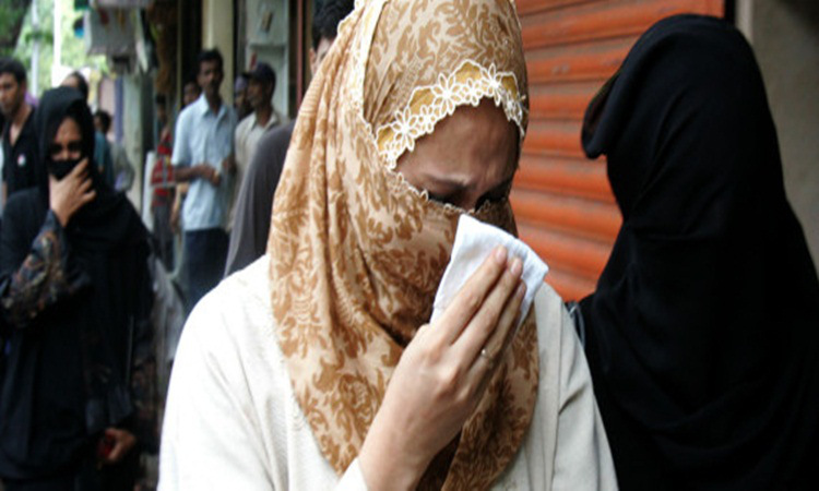 Raheen Memon center wife of Yakub Memon reacts as she arrives at a special court trying cases of the 1993 Mumbai bombings that killed 257 people in Mumbai India Friday