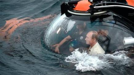 Russian president Vladimir Putin sits on board a bathyscaphe as it plunges into the Black Sea along the coast of Sevastopol Crimea