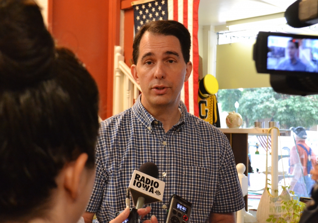 Scott Walker answers questions from reporters in Greenfield IA