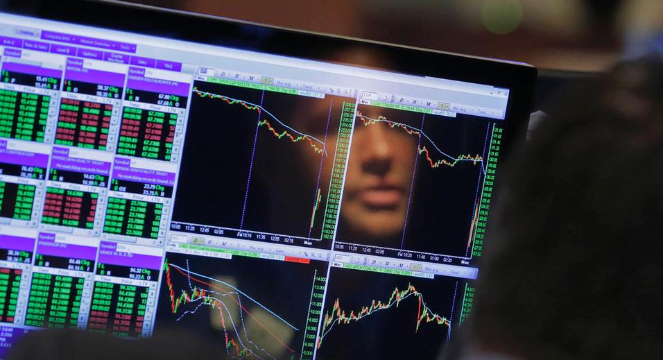 Specialist Frank Masiello is reflected in his screen on the floor of the New York Stock Exchange Monday Aug. 24 2015. U.S. stock markets plunged in early trading Monday following a big drop in Chinese stocks