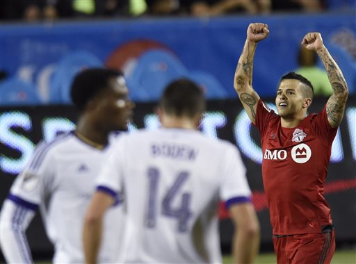 Toronto FC's Sebastian Giovinco celebrates his second goal of the night against Orlando City during the second half of an MLS soccer match Wednesday Aug. 5 2015 in Toronto. MANDATORY CREDIT