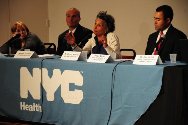 City Health Department officials discuss the outbreak at a town hall meeting in the Bronx Museum on Monday