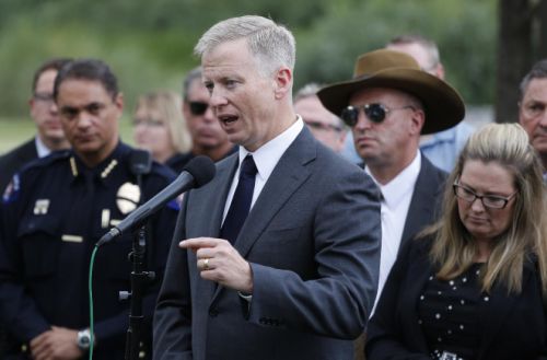 District Attorney George Brauchler speaks with members of the media following the reading of the jury's decision that Colorado theater shooter James Holmes will not receive the death penalty outside the Arapahoe County District Court in Centennial